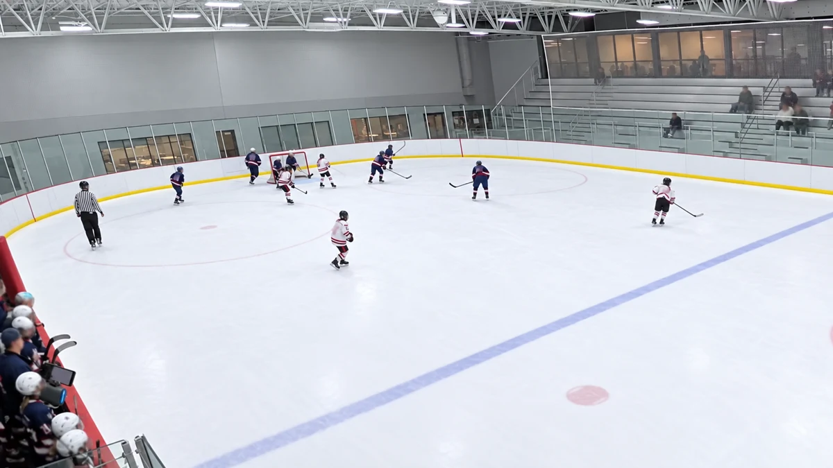 Privacy-edited still from a hockey game clip